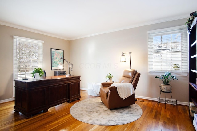 office area with baseboards, visible vents, crown molding, and hardwood / wood-style floors