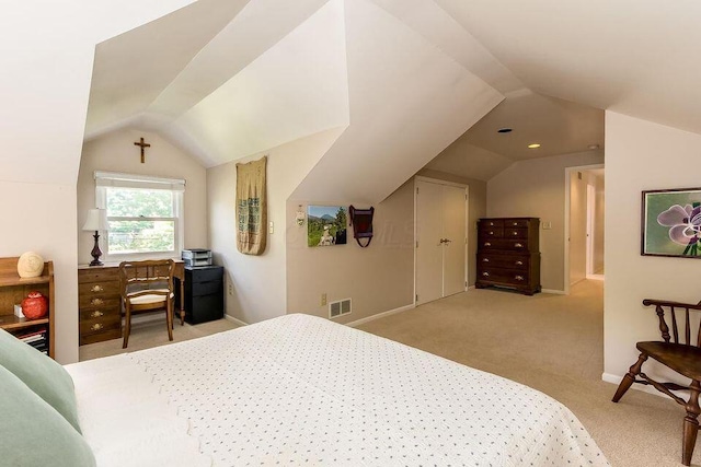 carpeted bedroom with lofted ceiling, visible vents, and baseboards