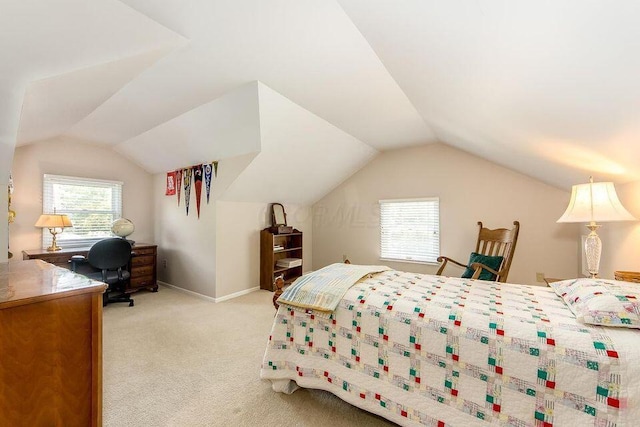 bedroom with lofted ceiling, multiple windows, and light colored carpet