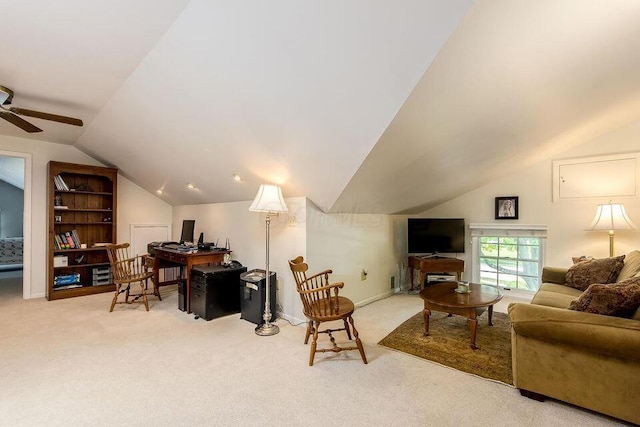 interior space featuring lofted ceiling, carpet, and a ceiling fan