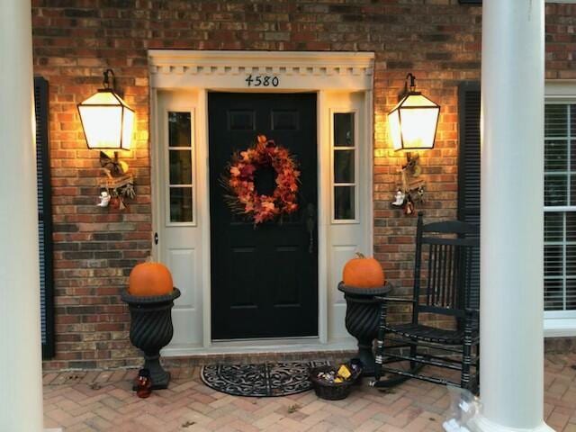 view of exterior entry with brick siding