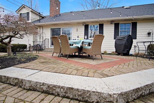 view of patio / terrace with outdoor dining area and a grill