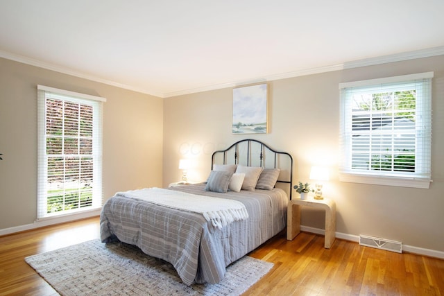 4580 Helston Ct, Columbus, OH 43220 - bedroom featuring ornamental molding, baseboards, and light wood finished floors
