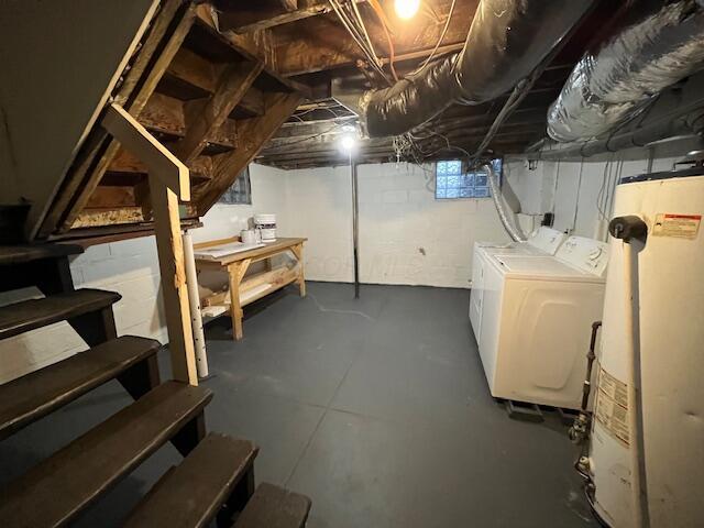 basement with separate washer and dryer and gas water heater