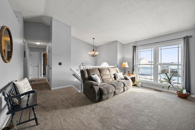 carpeted living room with a textured ceiling, a notable chandelier, and vaulted ceiling