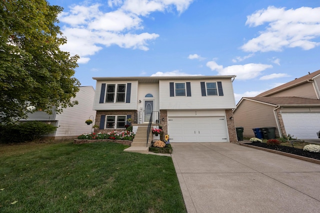 bi-level home with a garage and a front yard