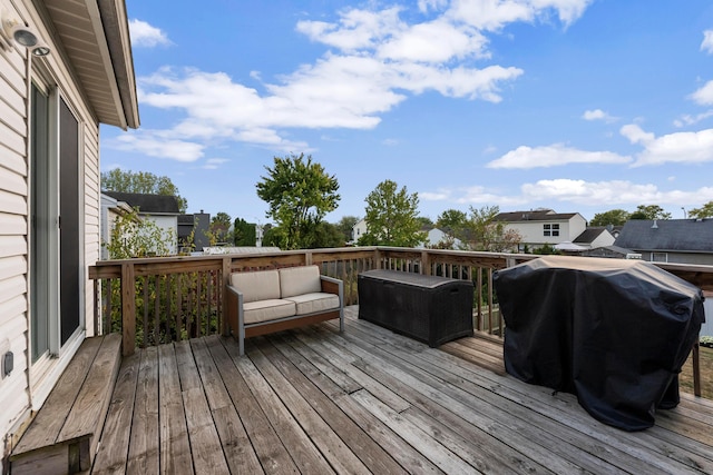 deck featuring an outdoor living space and area for grilling