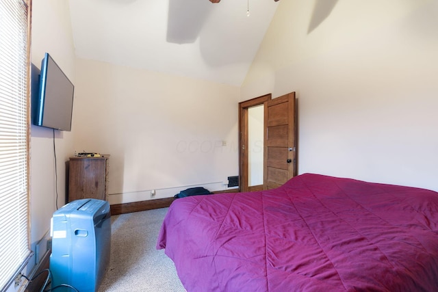 carpeted bedroom featuring vaulted ceiling