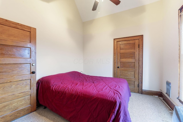 carpeted bedroom featuring ceiling fan and lofted ceiling