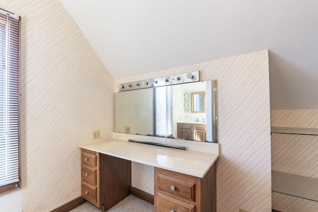 unfurnished office featuring lofted ceiling and sink