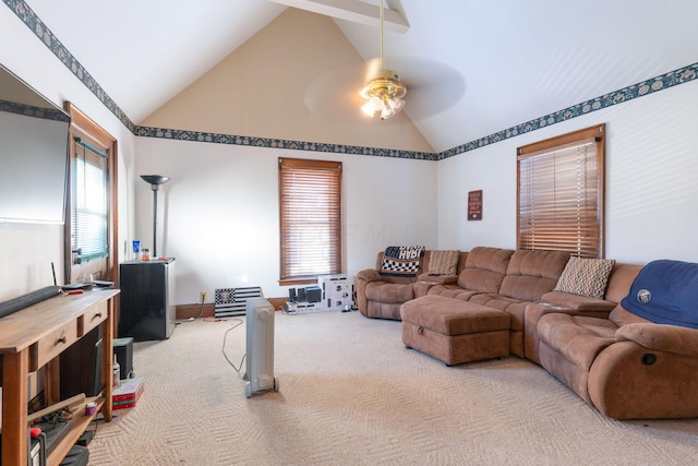 carpeted living room featuring ceiling fan and vaulted ceiling