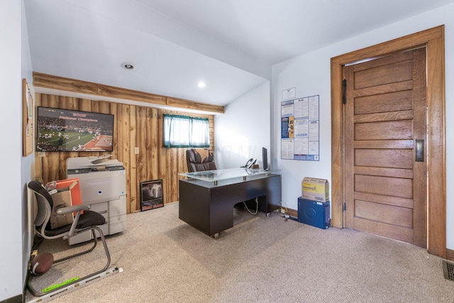 office area featuring light colored carpet and wood walls