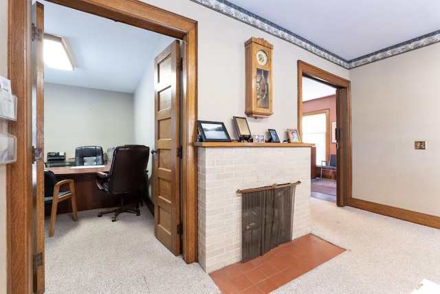 office space with light carpet and a fireplace