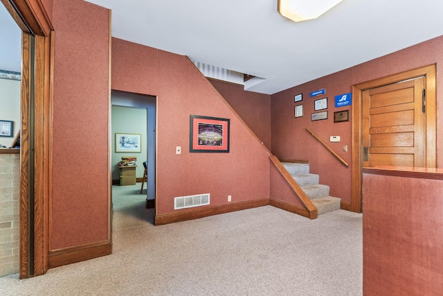 staircase with carpet flooring