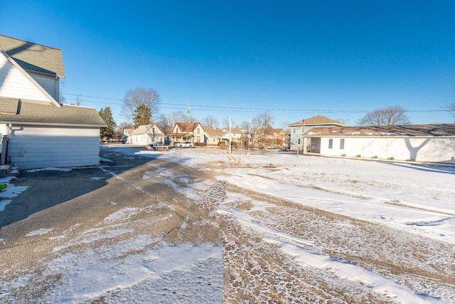 view of yard layered in snow