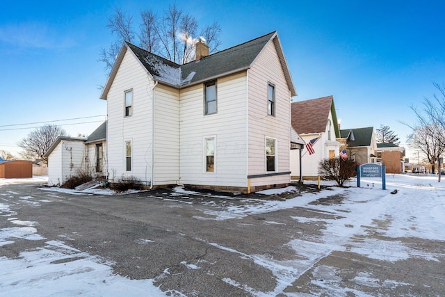 view of snow covered house