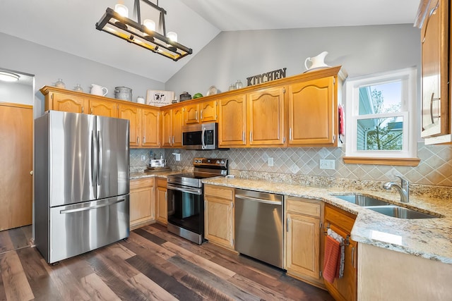 kitchen with appliances with stainless steel finishes, decorative backsplash, dark wood-type flooring, lofted ceiling, and sink