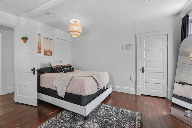 bedroom featuring dark hardwood / wood-style flooring