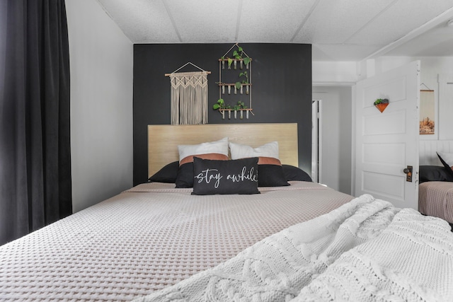 bedroom featuring a paneled ceiling