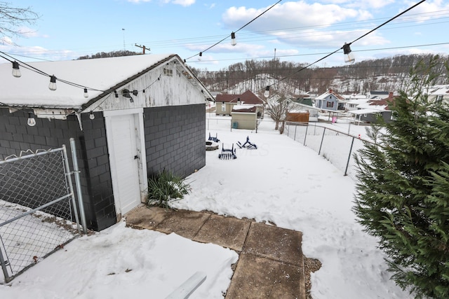 view of yard layered in snow