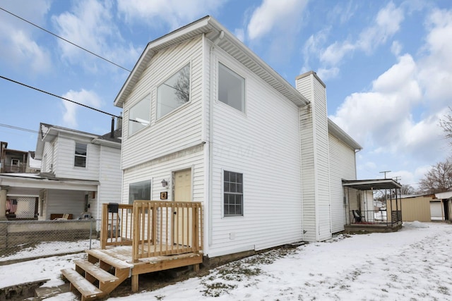 view of snow covered house