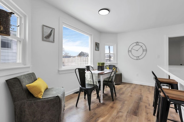 dining area with hardwood / wood-style floors