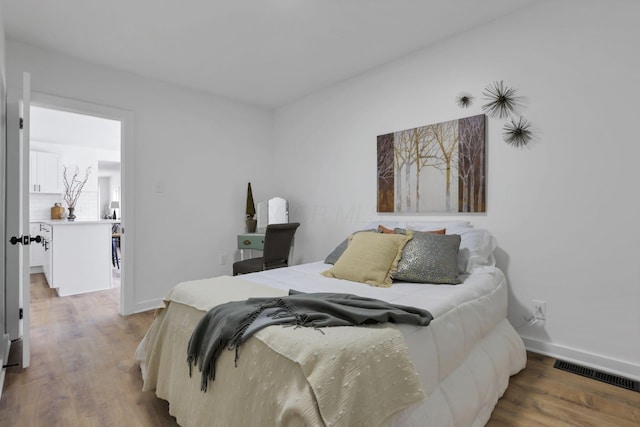 bedroom featuring hardwood / wood-style flooring