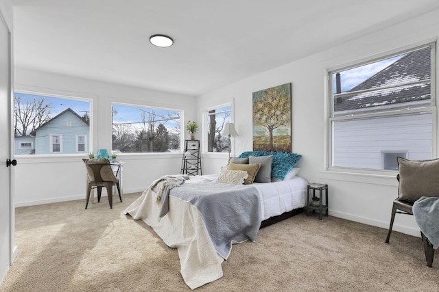 bedroom featuring light carpet