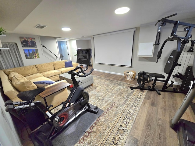 home theater room featuring wood-type flooring