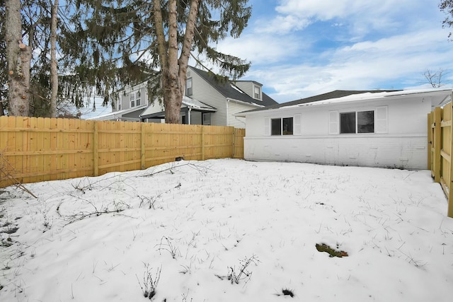 view of yard covered in snow