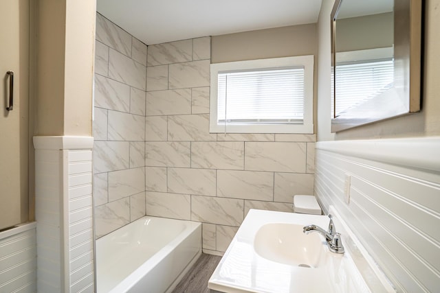 full bath featuring vanity, tile walls, and toilet