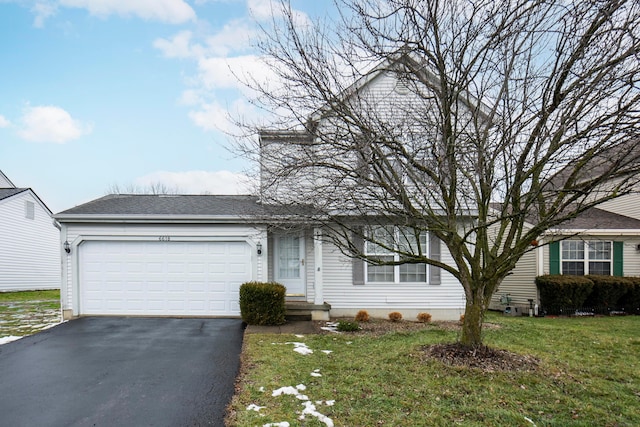 ranch-style house with a front lawn and a garage