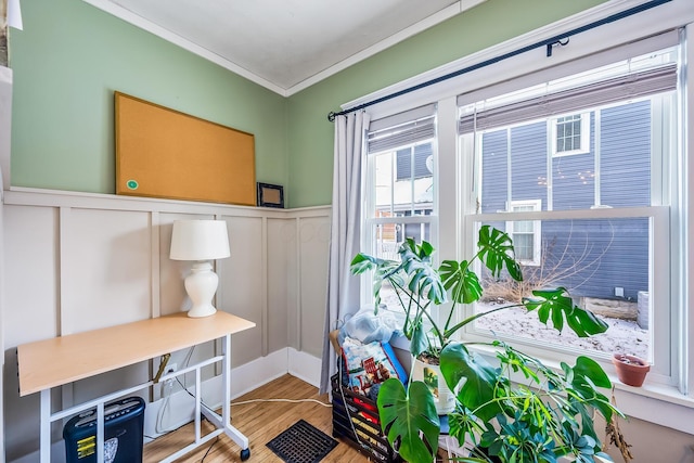 home office with ornamental molding and hardwood / wood-style floors