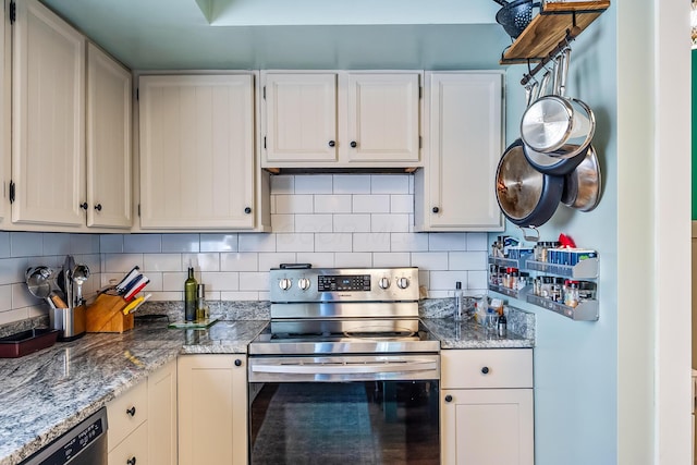 kitchen with black dishwasher, stainless steel electric range oven, and white cabinets