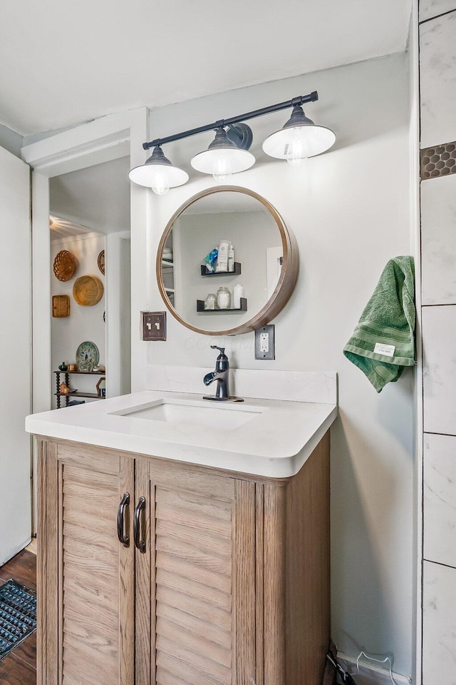 bathroom featuring hardwood / wood-style flooring and vanity