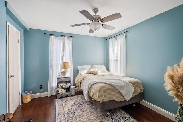 bedroom featuring dark wood-type flooring and ceiling fan