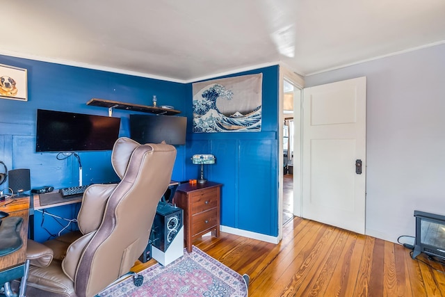 office with crown molding and hardwood / wood-style floors