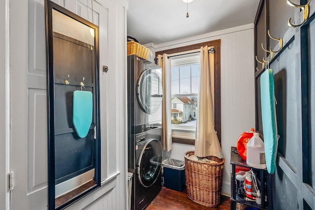 washroom featuring stacked washer / dryer