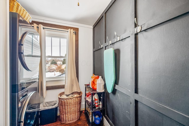 washroom featuring stacked washer / dryer