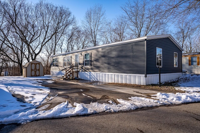 manufactured / mobile home with a shed