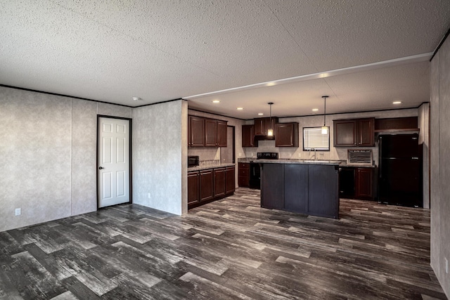 kitchen with pendant lighting, a center island, black appliances, sink, and dark brown cabinets