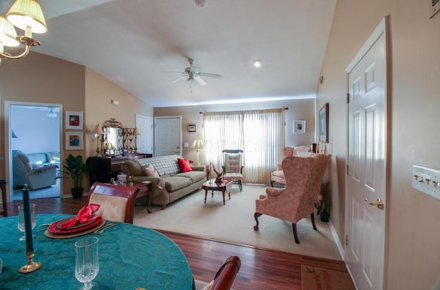 living room with vaulted ceiling, ceiling fan, and dark hardwood / wood-style floors