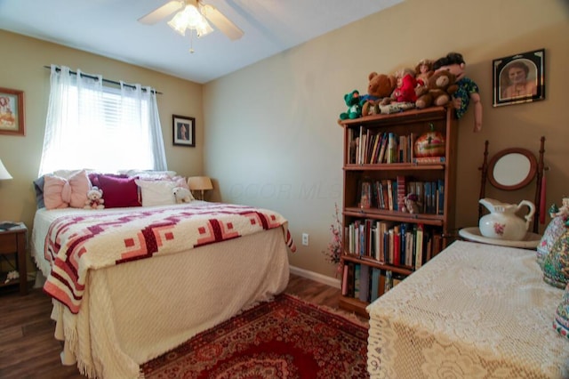 bedroom with ceiling fan and dark hardwood / wood-style flooring