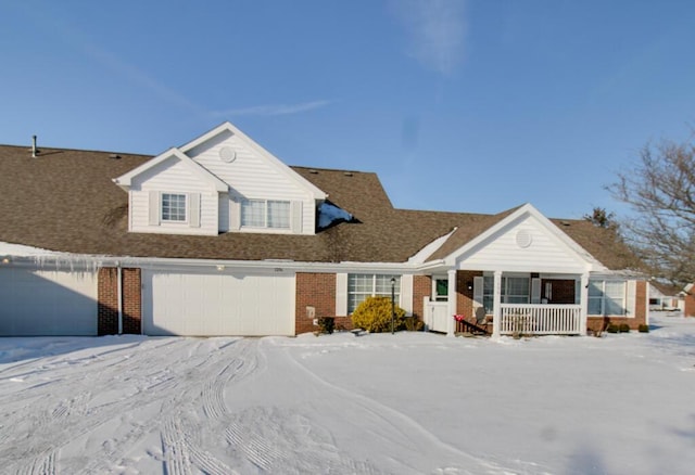 view of front of property featuring a porch and a garage