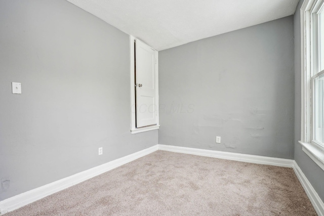 spare room featuring carpet floors