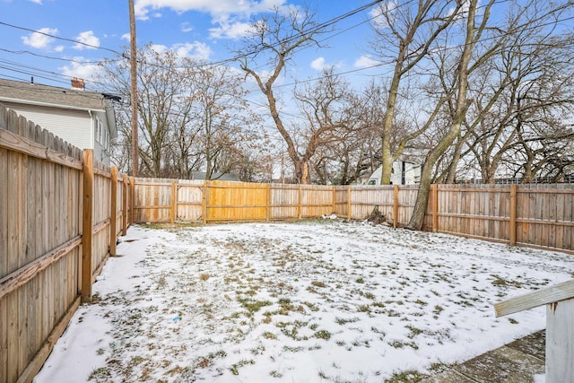 view of yard covered in snow