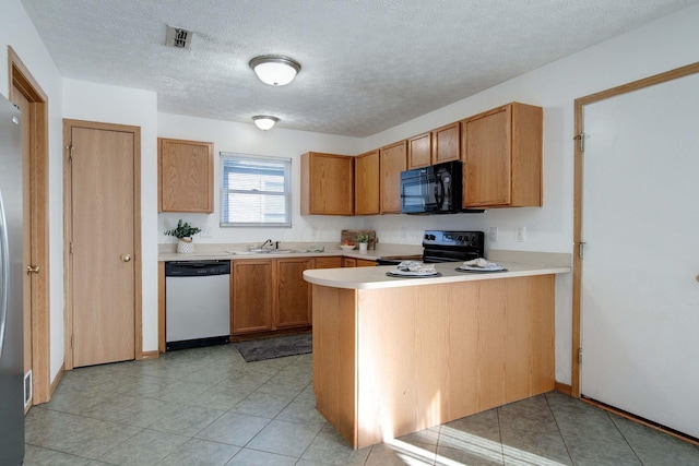 kitchen with kitchen peninsula, electric stove, a textured ceiling, stainless steel dishwasher, and sink