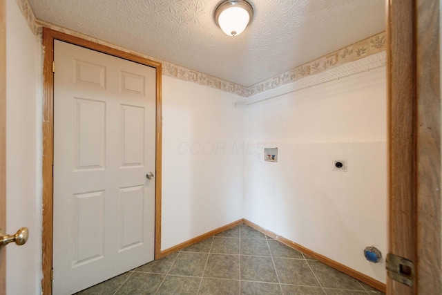 laundry area featuring washer hookup, a textured ceiling, and hookup for an electric dryer