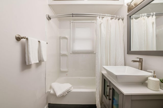 bathroom featuring shower / tub combo with curtain and vanity