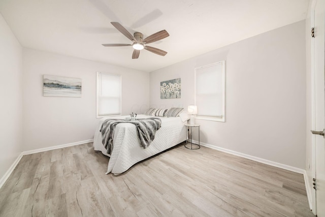 bedroom featuring ceiling fan and light hardwood / wood-style floors